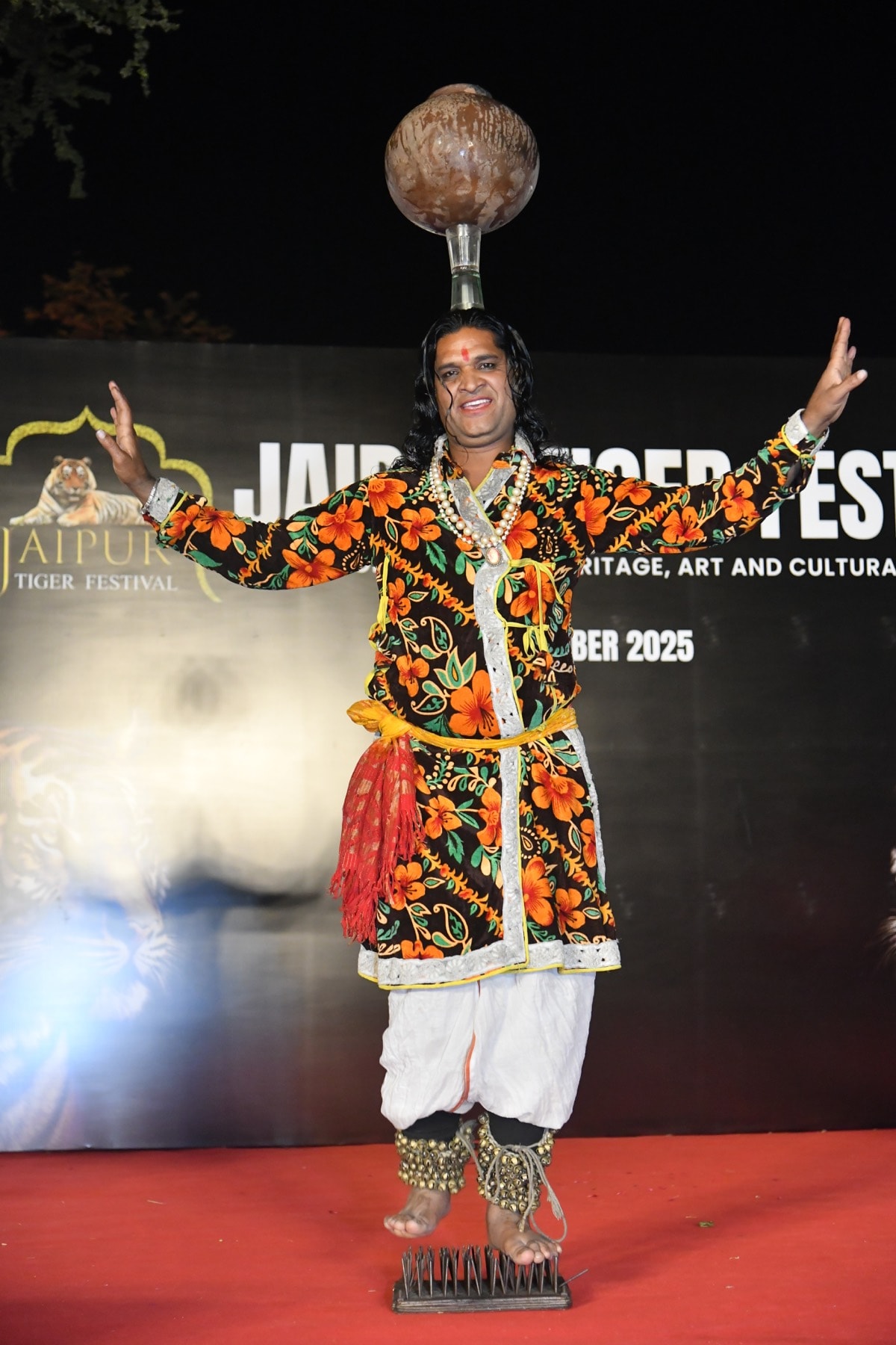 A poised moment of cultural storytelling unfolding through graceful movement and vivid costume.