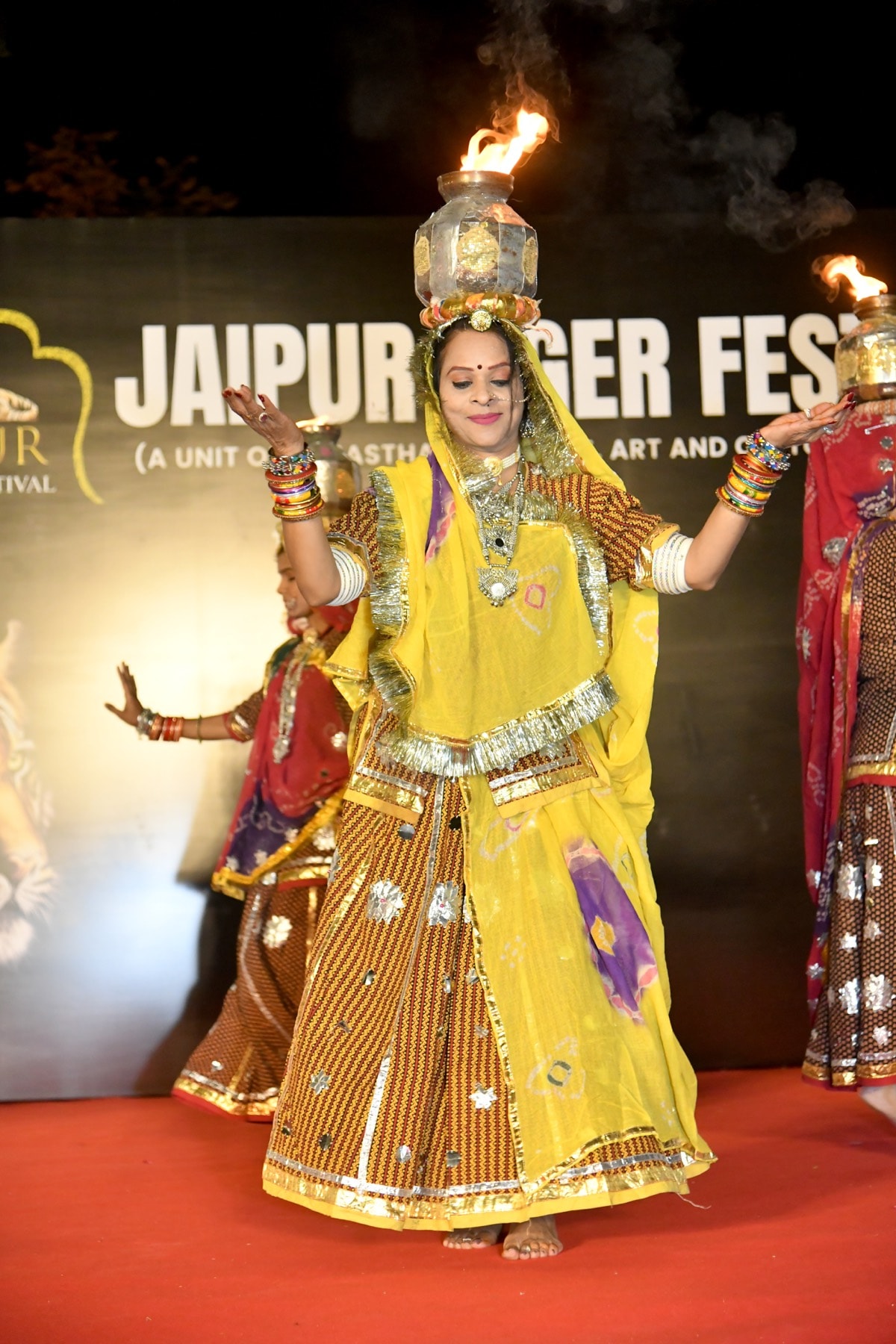 An elegant stage image carrying the warmth, rhythm, and ceremonial beauty of Rajasthan.